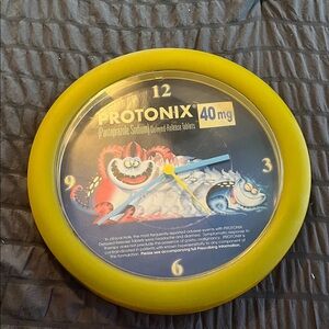 Yellow Protonix Wall Clock
